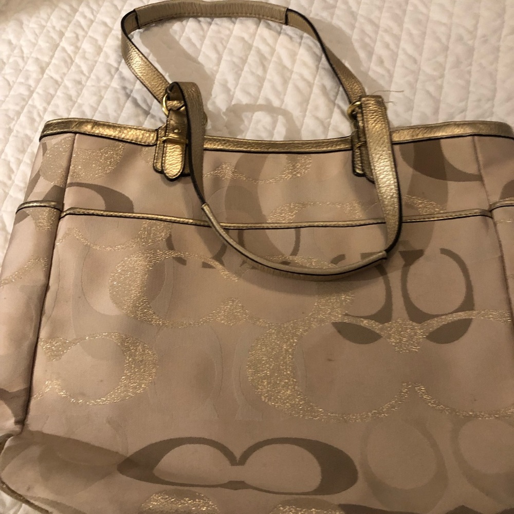 Beautiful Coach handbag with gold scents